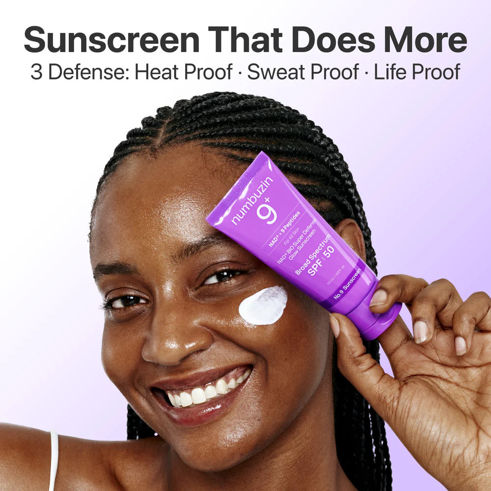 Woman applying sunscreen with a purple bottle labeled 'Numbuzin' on a light purple background.