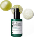 Green bottle of 'Bye Bye Blackhead' cleanser with bubbles on a white background
