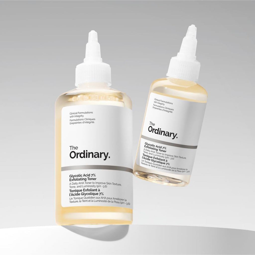 Two bottles of 'The Ordinary' toner on a gray background